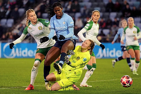 Women's Champions League: Manchester City's Khadija Shaw, center, and Hammaby IF's Eva Nystrom, left, challenge for the ball