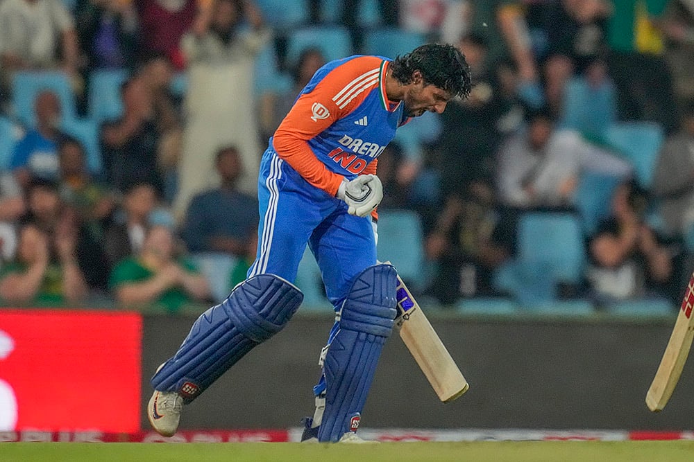 | Photo: AP/Themba Hadebe : Ind vs SA 3rd T20I: India's Tilak Varma celebrates after scoring a century