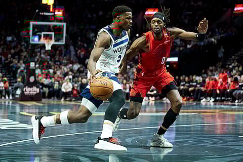 NBA Cup: Timberwolves guard Anthony Edwards, left, dribbles towards Trail Blazers forward Jerami Grant