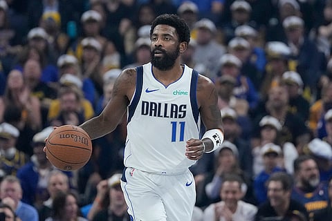 NBA Cup: Mavericks guard Kyrie Irving (11) brings the ball up the court against the Warriors