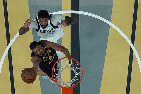 NBA Cup: Warriors guard De'Anthony Melton, bottom, shoots against Mavericks forward Naji Marshall (13)