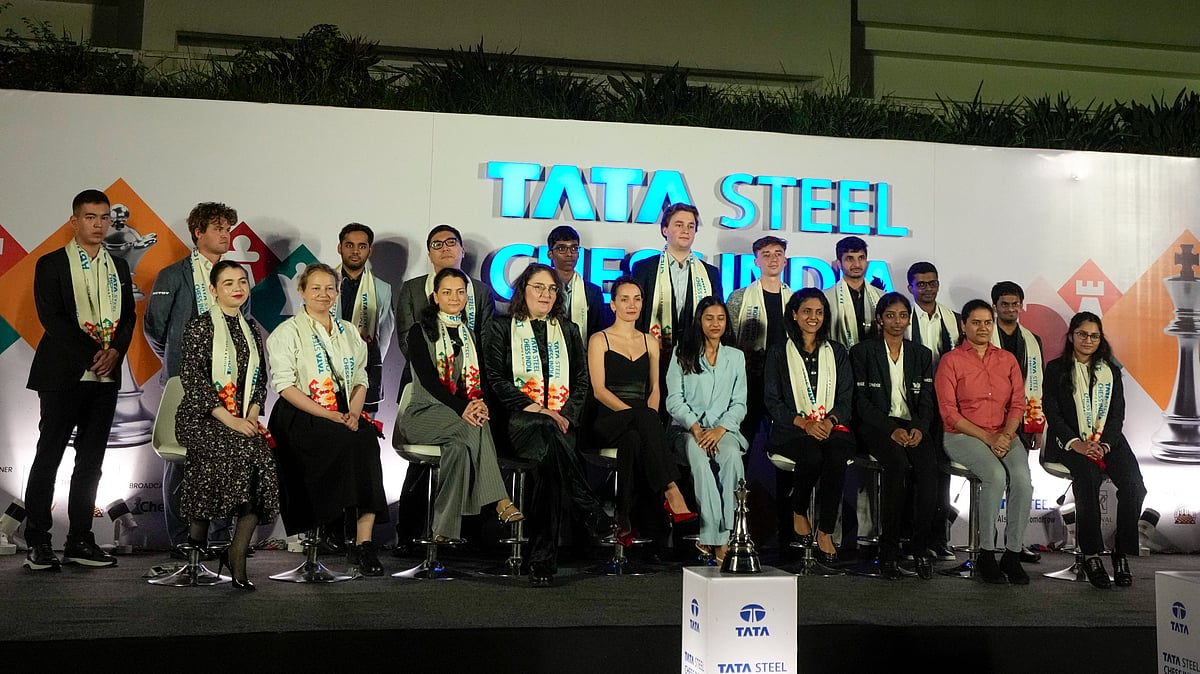 PTI/Swapan Mahapatra : Chess players pose for photos during draw of lots ceremony of Tata Steel Chess India Rapid and Blitz, in Kolkata.