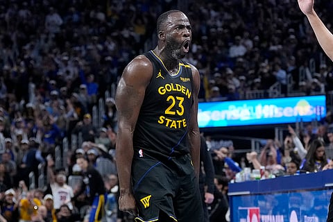 NBA Cup: Warriors forward Draymond Green reacts toward the Mavericks bench after shooting a 3-point basket