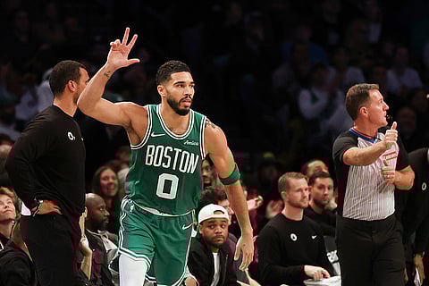 NBA: Celtics' Jayson Tatum reacts after scoring a three-point basket