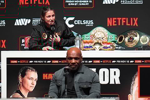 Tyson vs Paul boxing: Mike Tyson, bottom, listens as Katie Taylor speaks during a news conference