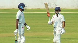 PTI : Priyank Panchal celebrates his half century on the first day of a Ranji Trophy cricket match between Vidarbha and Gujarat, in Nagpur.
