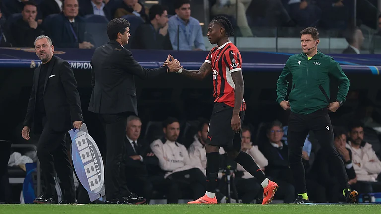 AC Milan head coach Paulo Fonseca with Rafael Leao. - null