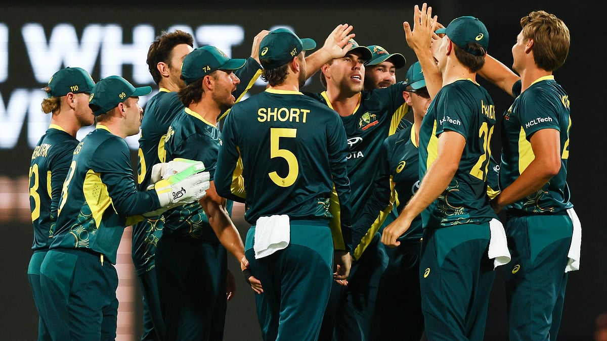 Tertius Pickard/AP : Australian players celebrate after dismissing Pakistan's Sahibzada Farhan during the T20 cricket international between Pakistan and Australia at the Gabba in Brisbane