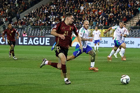 UEFA Nations League soccer: Belgium's Timothy Castagne, center left, fights for the ball with Italy's Federico Dimarco