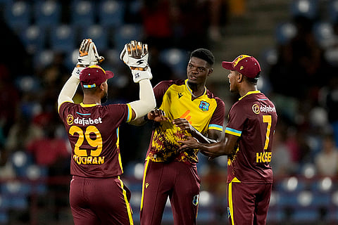 WI Vs ENG, 3rd T20I: West Indies' Alzarri Joseph celebrates with teammates after the dismissal of England's captain Jos Buttler