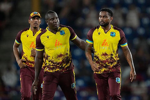 WI Vs ENG, 3rd T20I: West Indies' captain Rovman Powell, left, pats bowler Terrance Hinds