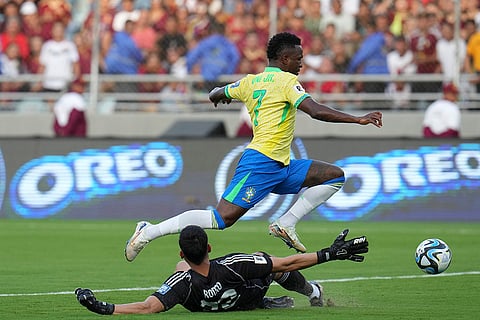 FIFA World Cup 2026 Qualifiers: Brazil's Vinicius Junior jumps over Venezuela's goalkeeper Rafael Romo