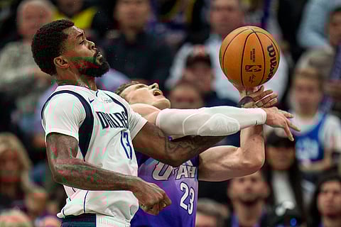 NBA Mavericks vs Jazz Basketball: Mavericks forward Naji Marshall (13) goes for a rebound along with Utah Jazz forward Lauri Markkanen