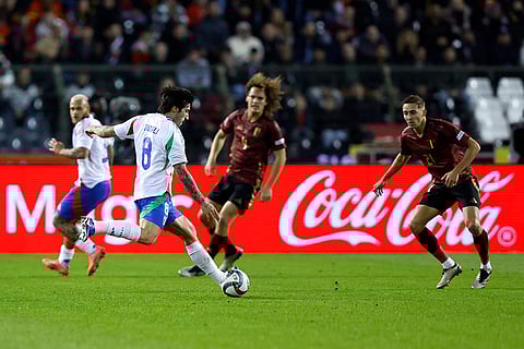 UEFA Nations League soccer: Italy's Sandro Tonali, second left, is challenged by Belgium's Timothy Castagne
