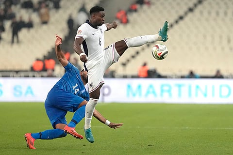 UEFA Nations League soccer: England's Marc Guehi, right, and Vangelis Pavlidis of Greece vie for the ball