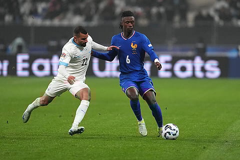 UEFA Nations League soccer: France's Eduardo Camavinga, right, and Israel's Mahmoud Jaber challenge for the ball