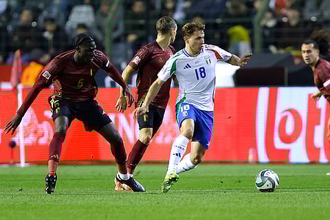 UEFA Nations League soccer: Italy's Nicolo Barella, center, fights for the ball with Belgium's Amadou Onana