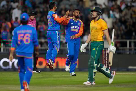 IND vs SA 4th T20: India's Varun Chakravarthy, second right, celebrates with teammates after the dismissal of South Africa's David Miller