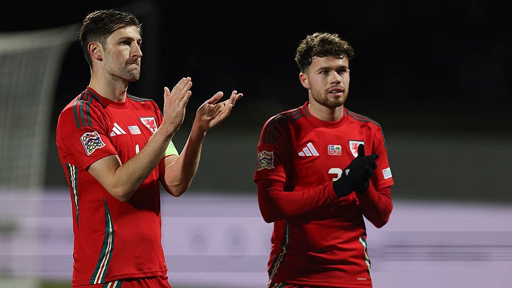 | Photo: AP/Arni Torfason : Nations League Soccer: Ben Davies of Wales, left, and Neco Williams applaud the crowd