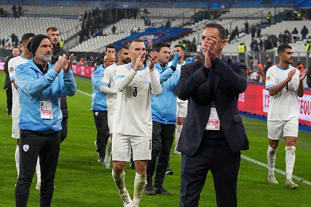 | Photo: AP/Michel Euler : UEFA Nations League soccer: Israel team members react to their supporters