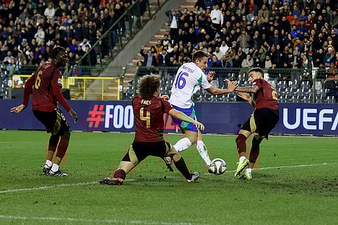 UEFA Nations League soccer: Italy's Davide Frattesi, second right, fights for the ball against Belgium's Wout Faes