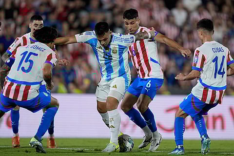 FIFA World Cup 2026 Qualifiers: Argentina's Lautaro Martinez (22) and Paraguay's Junior Alonso battle for the ball
