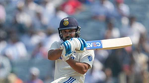 AP Photo/Rafiq Maqbool : India's captain Rohit Sharma playing a shot in a Test match.