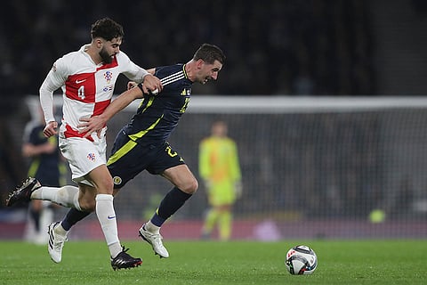 UEFA Nations League: Croatia's Josko Gvardiol, left, duels for the ball with Scotland's Kenny McLean