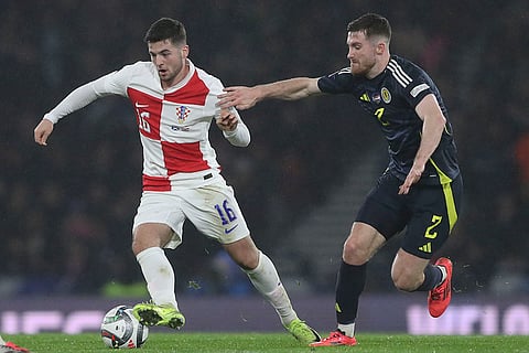 UEFA Nations League: Croatia's Martin Baturina, left, duels for the ball with Scotland's Anthony Ralston