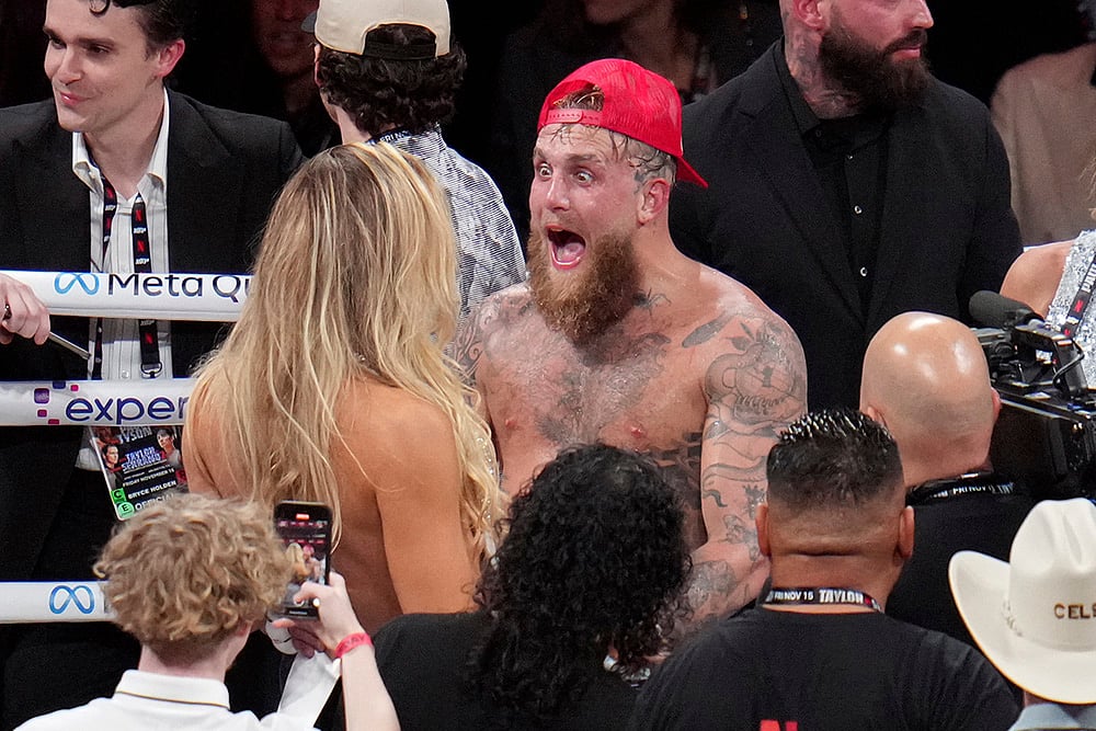 | Photo: AP/Julio Cortez : Tyson vs Paul Boxing: Jake Paul reacts after defeating Mike Tyson