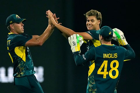 AUS vs PAK 2nd T20I: Australia's Spencer Johnson, second right, celebrates with teammates the wicket of Pakistan's Sahibzada Farhan