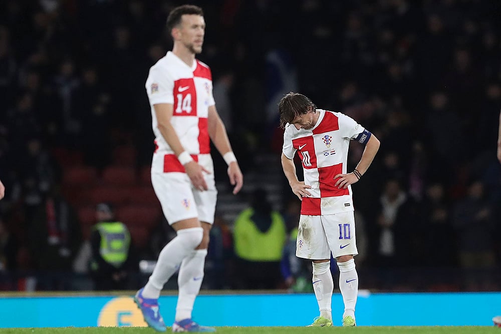 | Photo: AP/Scott Heppell : UEFA Nations League: Croatia's Luka Modric, right, and Ivan Perisic react at the end of match