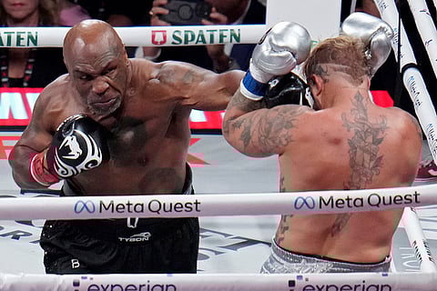 Tyson vs Paul Boxing: Mike Tyson lands a left to Jake Paul