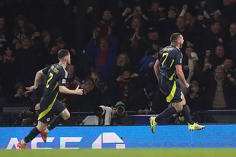 UEFA Nations League: Scotland's John McGinn, right, celebrates after scoring the opening goal