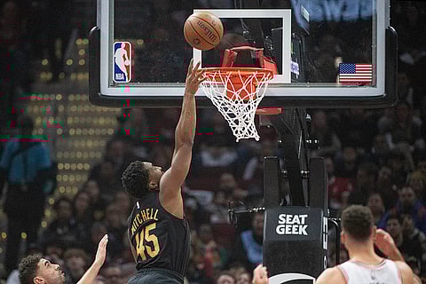 NBA: Cavaliers' Donovan Mitchell (45) makes a basket against the Bulls