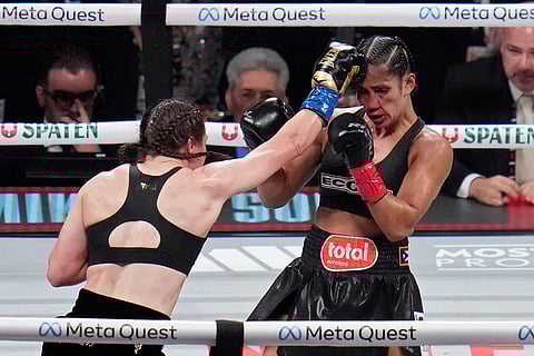 Serrano vs Taylor Boxing: Katie Taylor, left, lands a right to Amanda Serrano