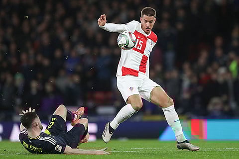 UEFA Nations League: Scotland's Anthony Ralston, left, duels for the ball with Croatia's Mario Pasalic