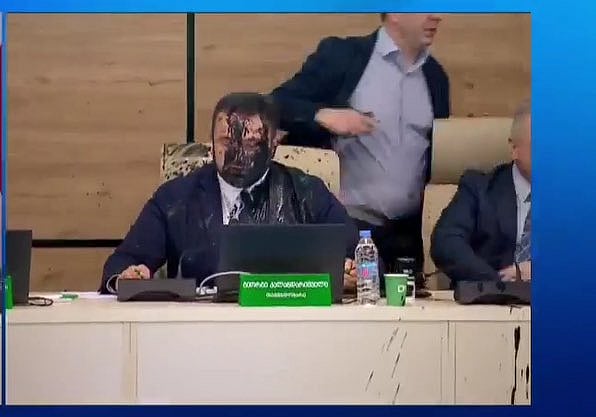 X/@Mikiashvili_M : Georgia election chief Giorgi Kalandarishvili doused in black paint.