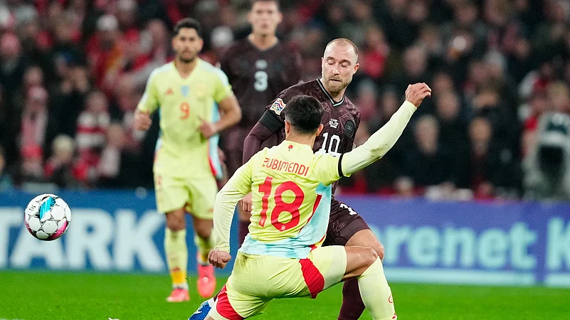 Spains Martin Zubimendi, front, and Denmarks Christian Eriksen. AP Photo