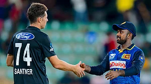 AP/Viraj Kothalawala : New Zealand's captain Mitchell Santner, left, congratulates Sri Lanka's captain Charith Asalanka for winning the first ODI in Dambulla.