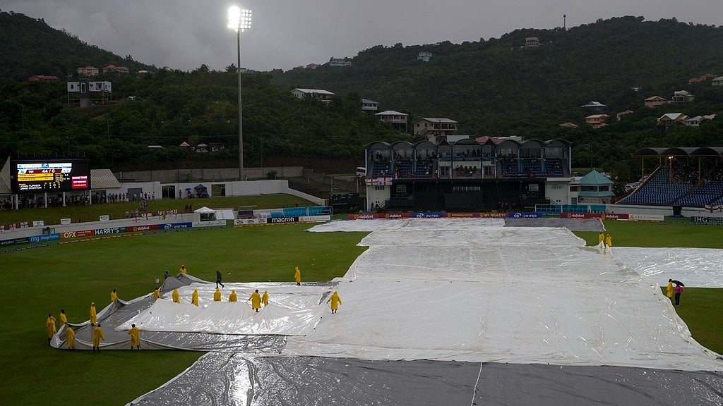 AP/Ricardo Mazalan : Ground staff move the covers as rain disrupts the fifth T20I between West Indies and England at Daren Sammy National Cricket Stadium in Gros Islet, St. Lucia.