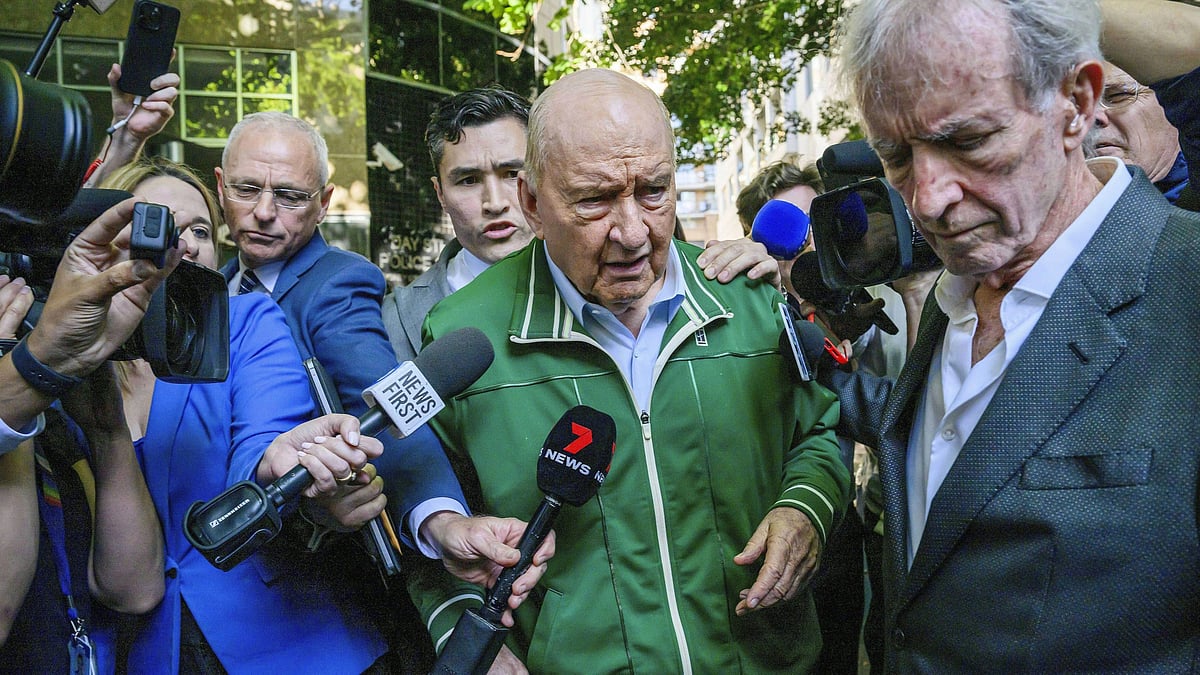 AP : Australian broadcaster Alan Jones (in green) has been charged with 24 sexual offenses.
