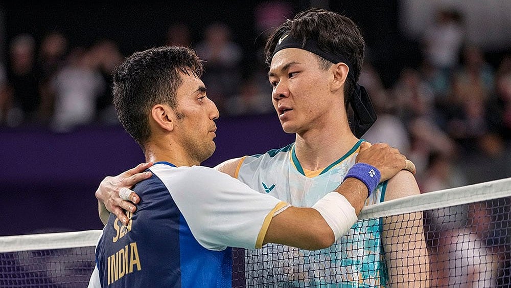 | Photo: PTI/Ravi Choudhary : Lakshya Sen and Lee Zii Jia greet each other after their bronze medal match