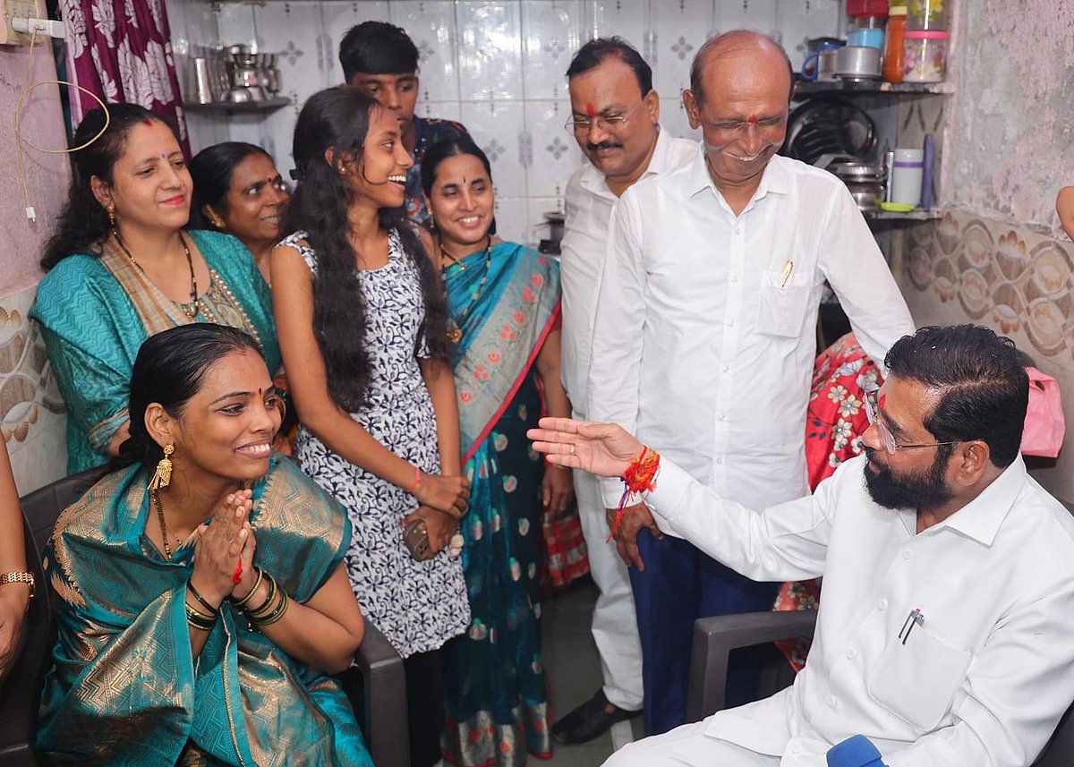 Chief Minister Eknath Shinde with a family