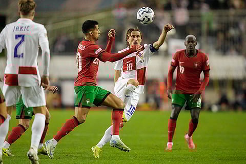 Nations League Soccer: Croatia's Luka Modric challenges for the ball with Portugal's Joao Cancelo