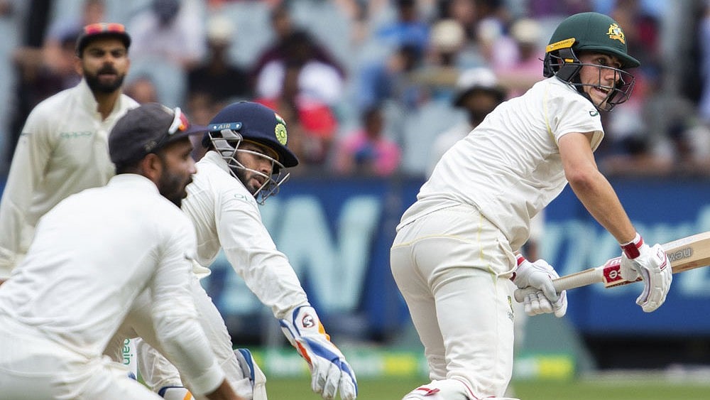India vs Australia: Pat Cummins of AUS (right) bats on. - File