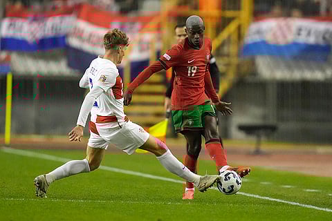 Nations League Soccer: Portugal's Nuno Mendes challenges for the ball with Croatia's Kristijan Jakic