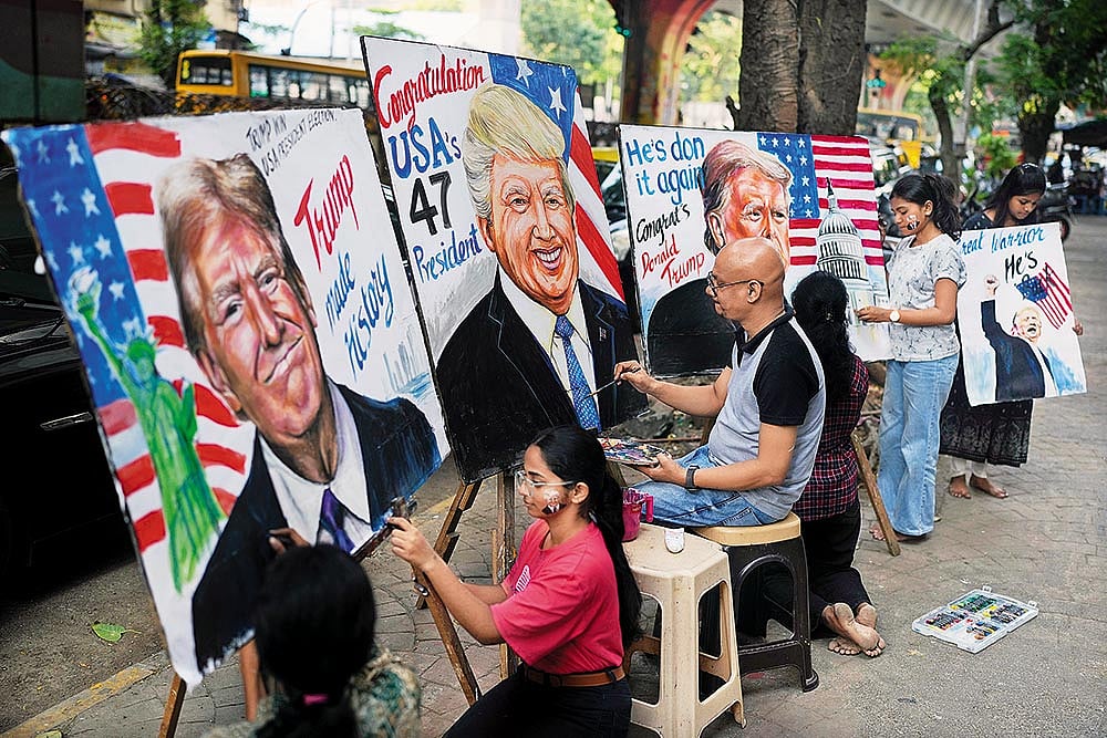 | Photo: AP : India-US Bonhomie: Students of the Gurukul School of Art paint portraits of Donald Trump in Mumbai on November 6, 2024