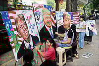 Trump, Up And Charging | Photo: AP : India-US Bonhomie: Students of the Gurukul School of Art paint portraits of Donald Trump in Mumbai on November 6, 2024