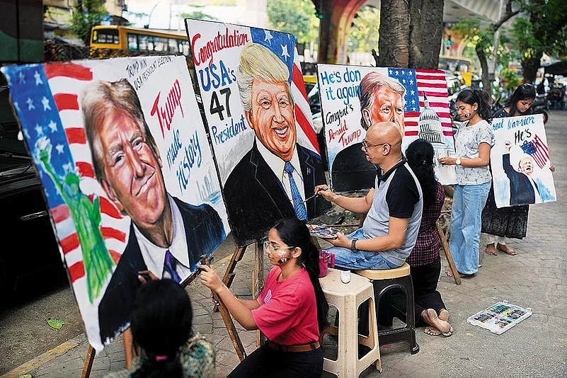 Students of the Gurukul School of Art paint portraits of Donald Trump in Mumbai